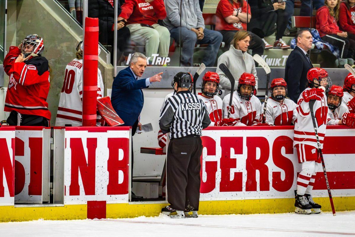 UW hockey coach Mark Johnson talks to a referee. March 8, 2024.