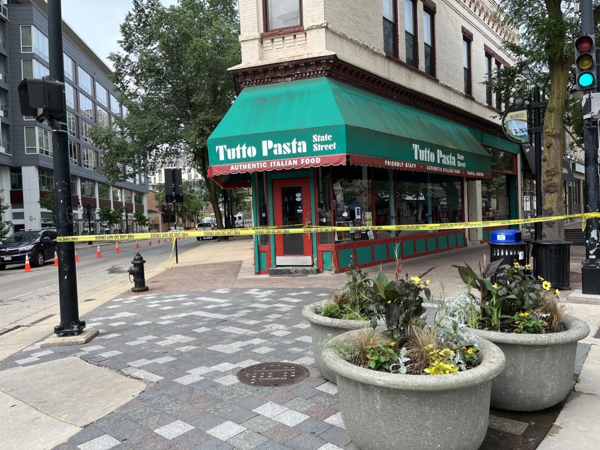MFD establishes perimeter around 300 N Broom St block after underground explosion lifts manhole cover from the ground, June 17, 2024. 